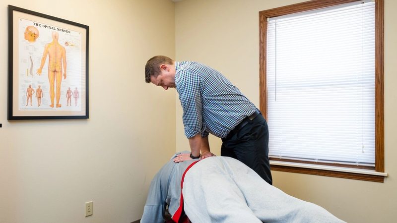 Dr. Wunderlich working on a patient's back at Wunderlich Chiropractic